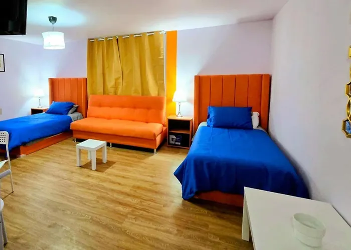 Suite Naranja moderna para 3 huéspedes Cocina equipada, Wi-Fi rápido y excelente ubicación céntrica
